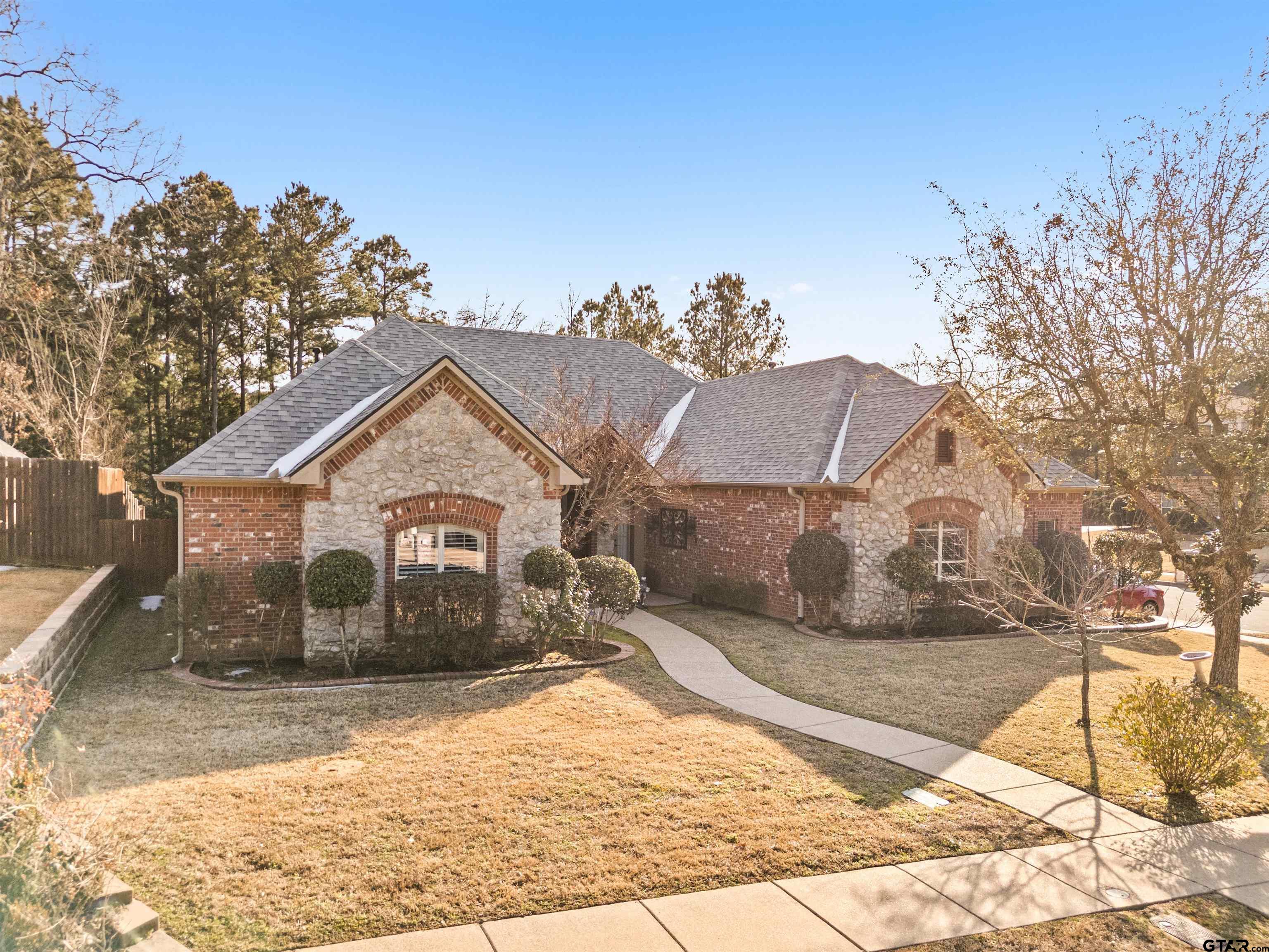 714 Huntwick Lane Tyler, TX 75703 - Photo 14 of 39 a view of a house with a yard