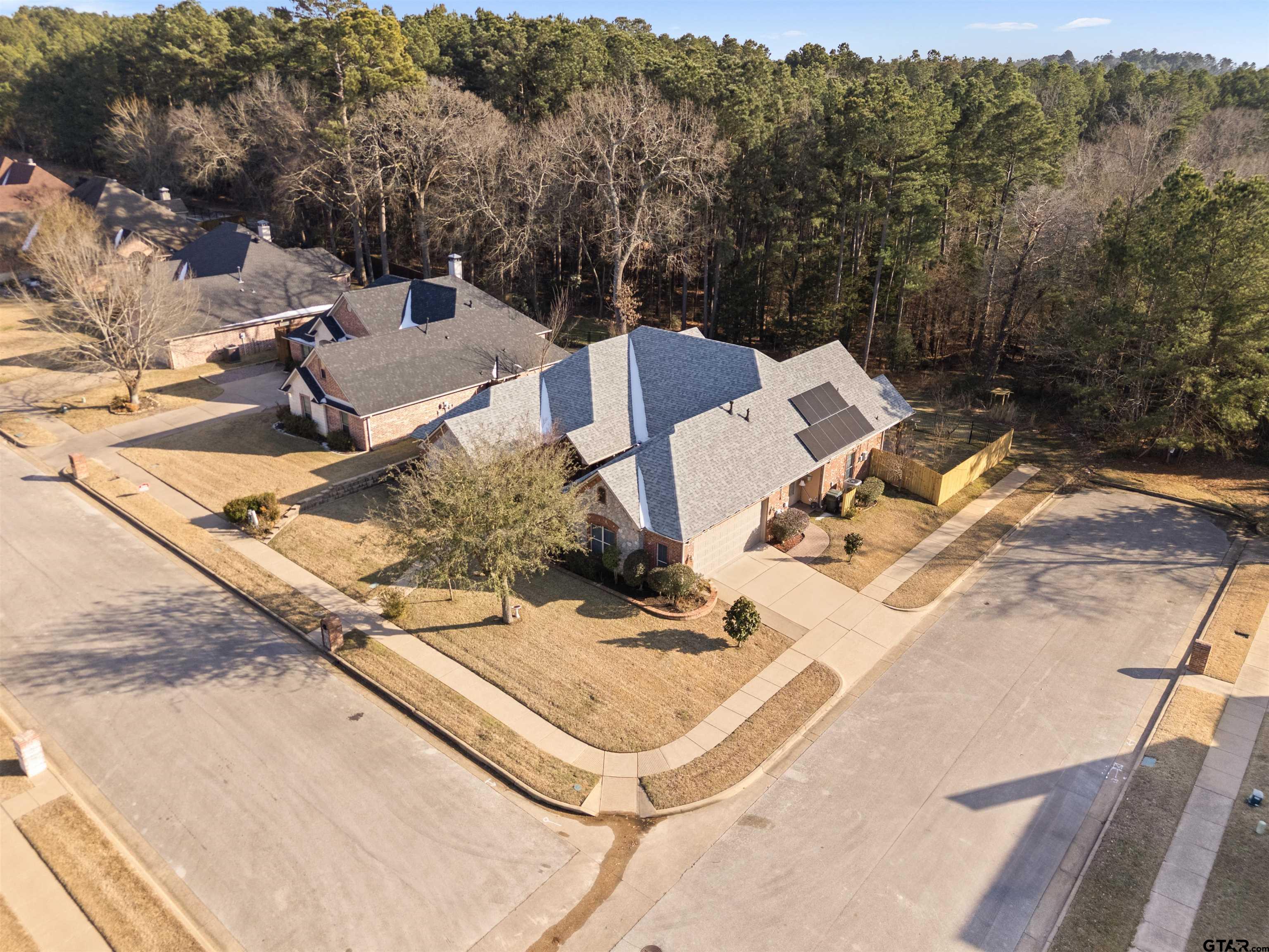 714 Huntwick Lane Tyler, TX 75703 - Photo 19 of 39 a view of a backyard with sitting area