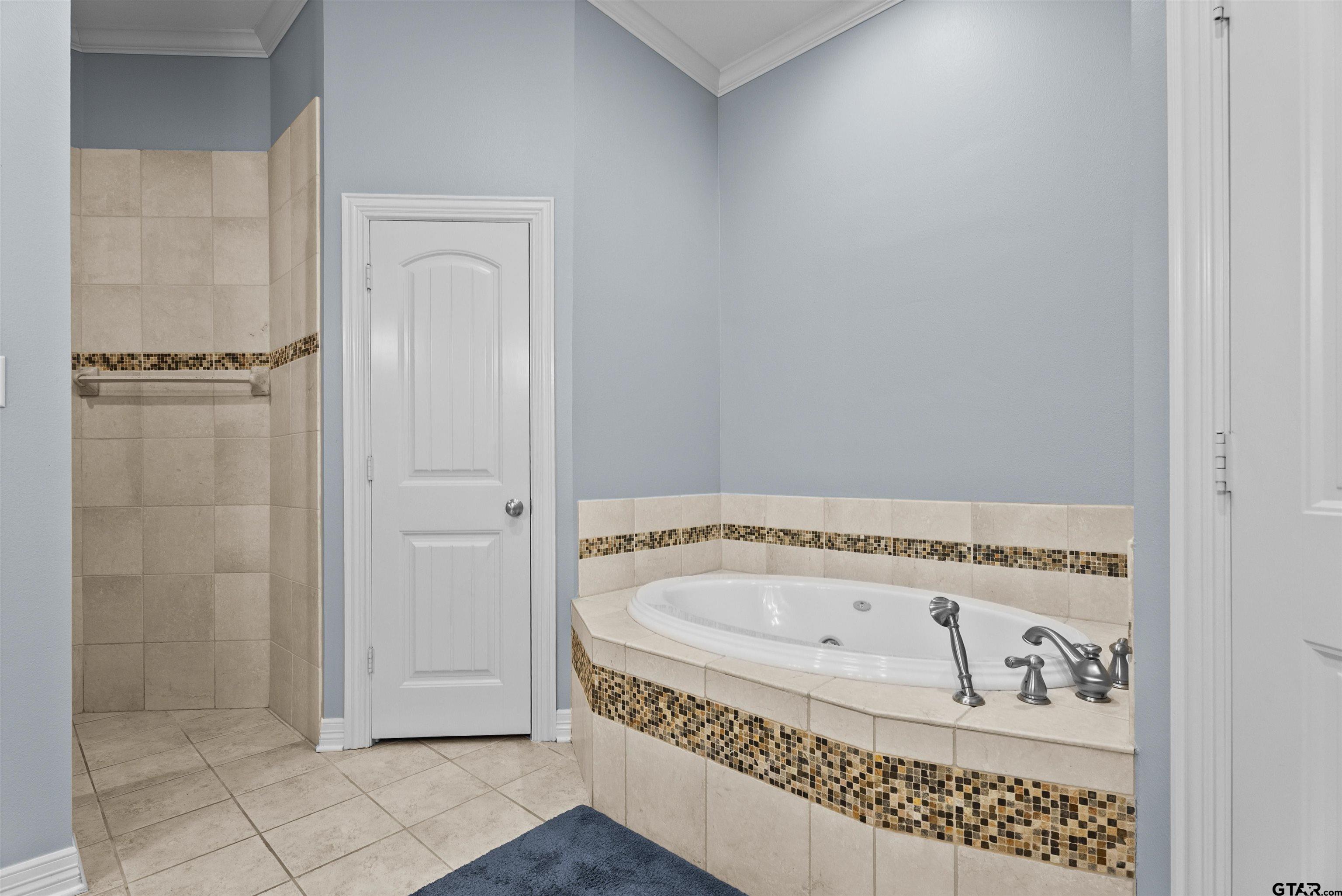 714 Huntwick Lane Tyler, TX 75703 - Photo 2 of 39 a bathroom with a bathtub