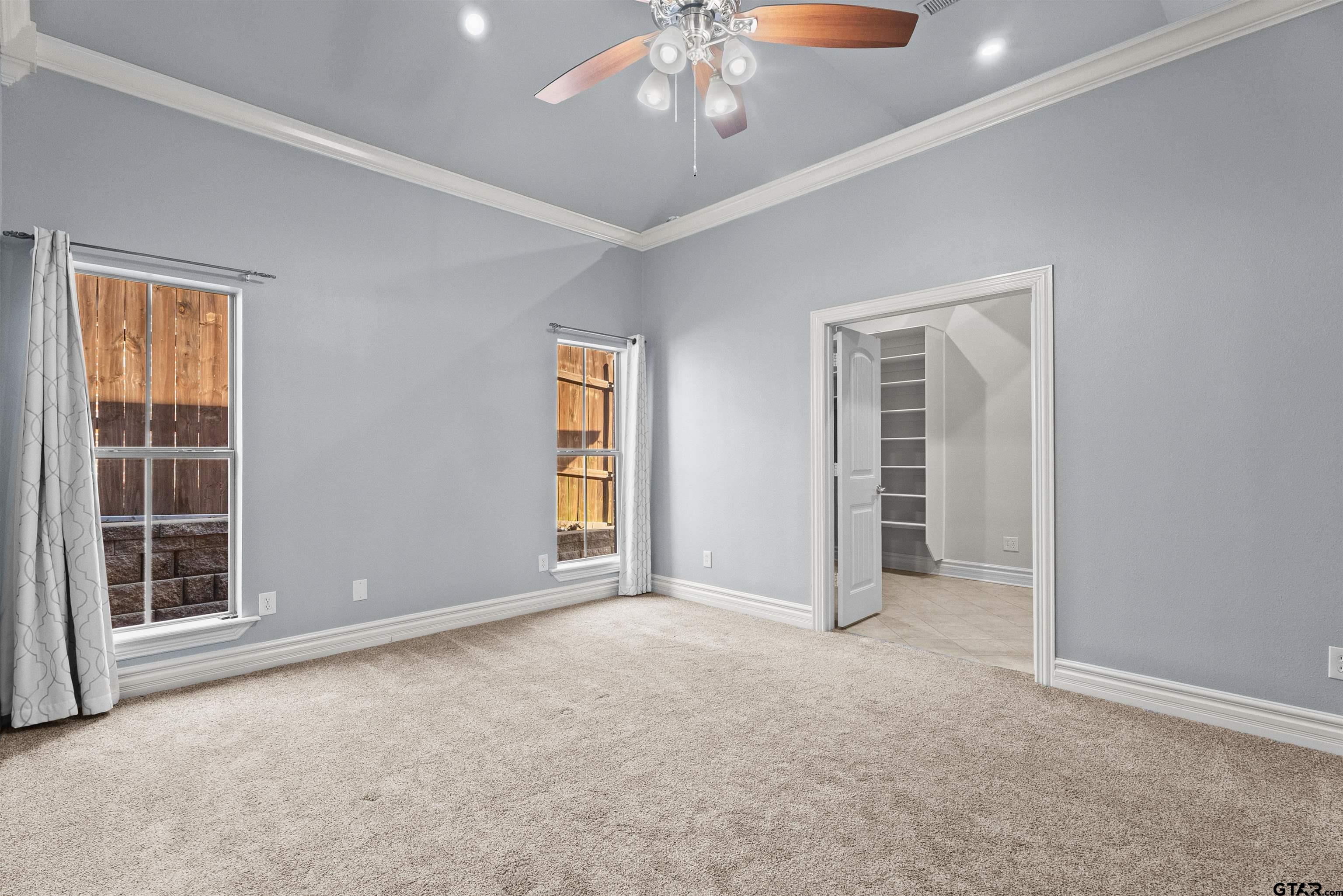 714 Huntwick Lane Tyler, TX 75703 - Photo 21 of 39 an empty room with windows and closet
