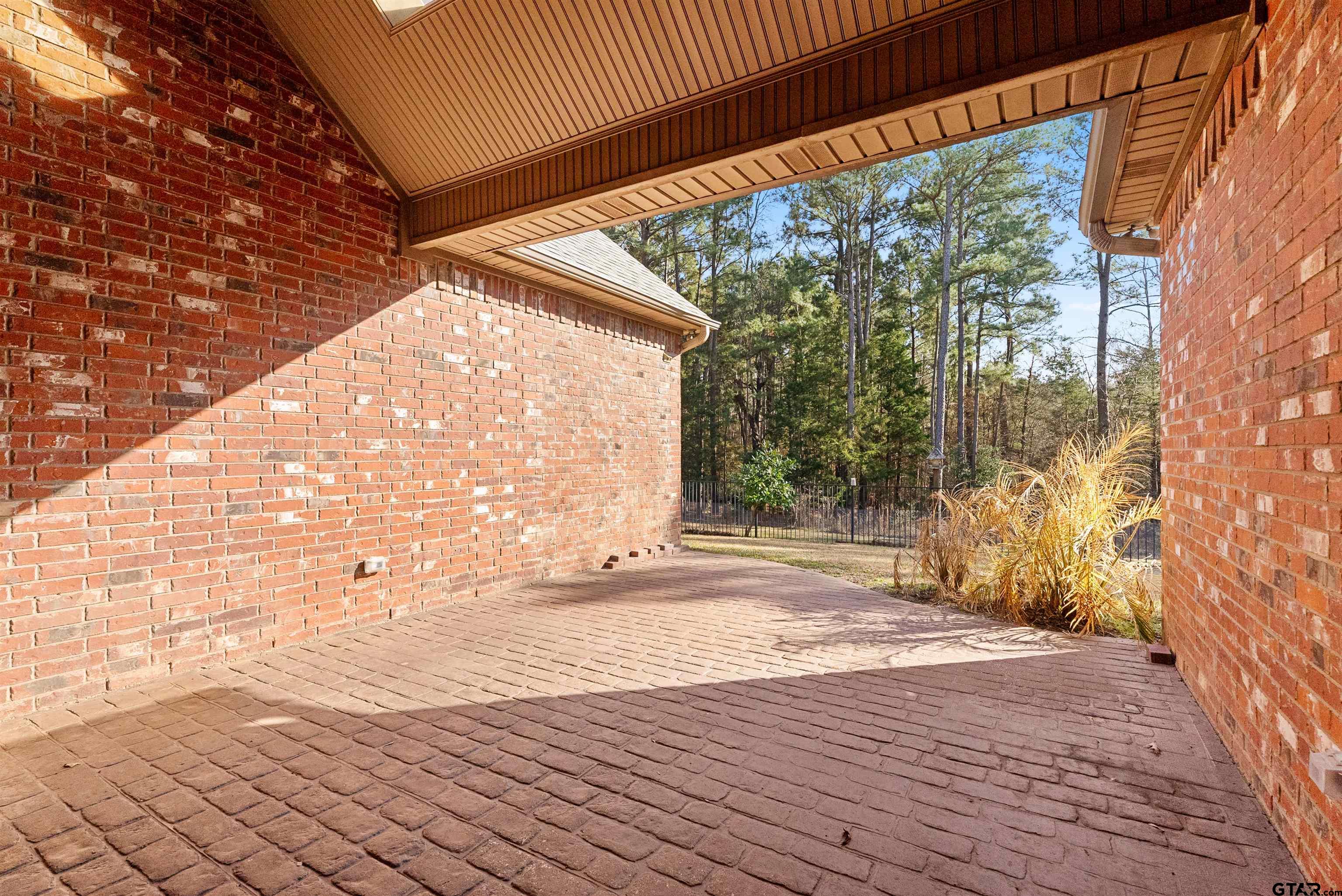 714 Huntwick Lane Tyler, TX 75703 - Photo 33 of 39 a view of empty room with wooden floor and fence