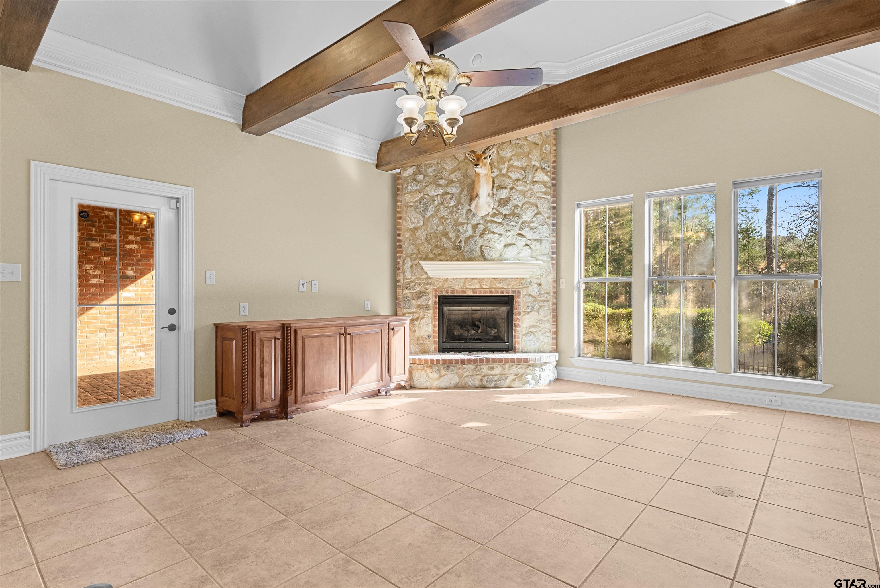 714 Huntwick Lane Tyler, TX 75703 - Photo 34 of 39 a view of an empty room with a fireplace and a window