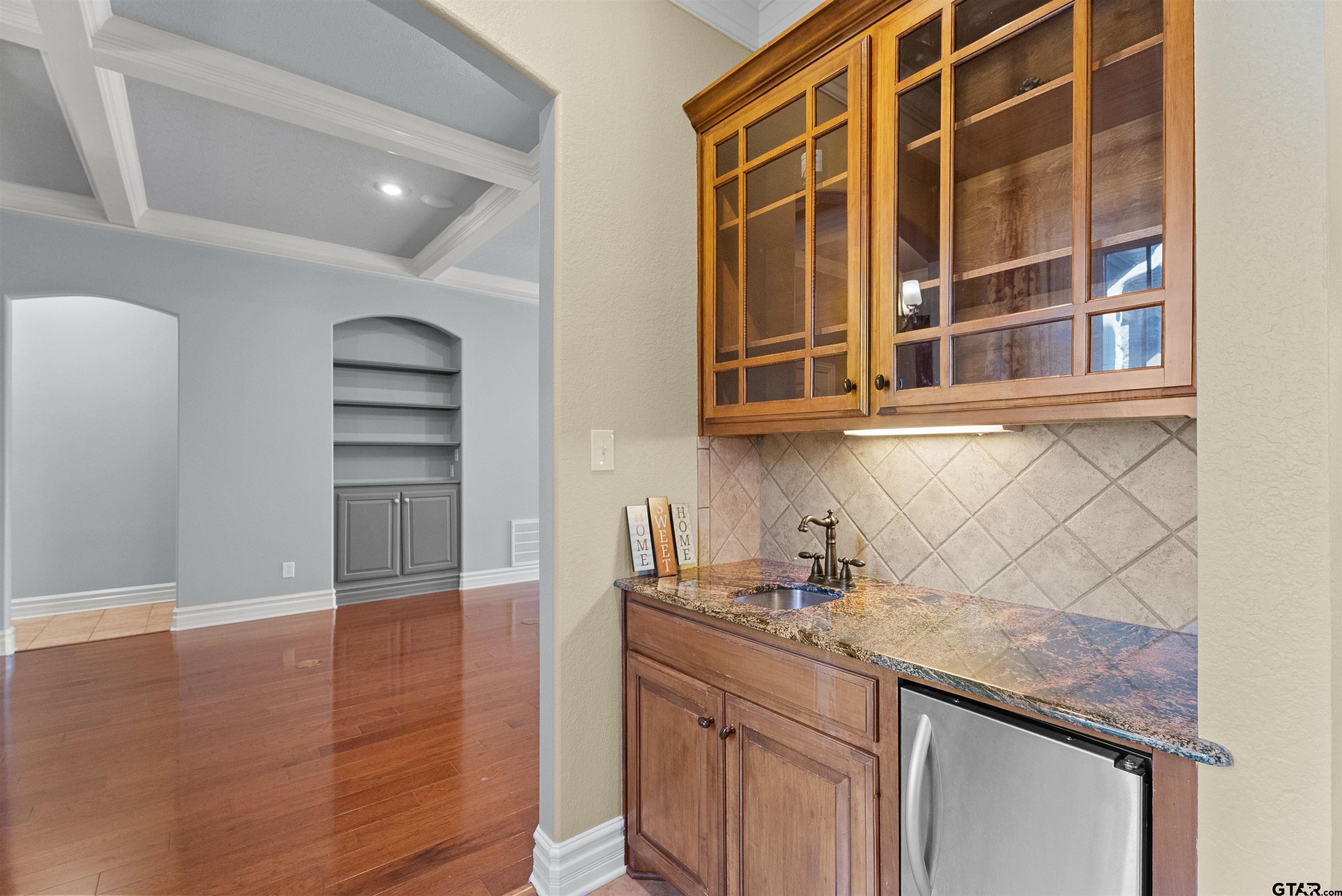 714 Huntwick Lane Tyler, TX 75703 - Photo 35 of 39 a kitchen with stainless steel appliances granite countertop a sink and cabinets