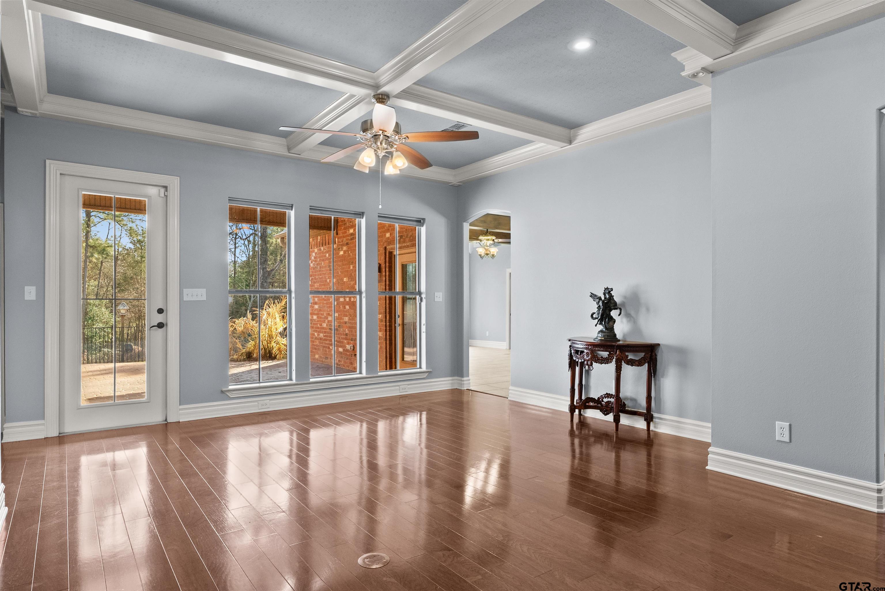 714 Huntwick Lane Tyler, TX 75703 - Photo 37 of 39 a view of an empty room with wooden floor and a window