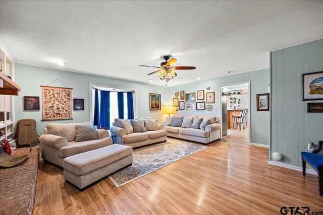 a living room with furniture or couch and a wooden floor