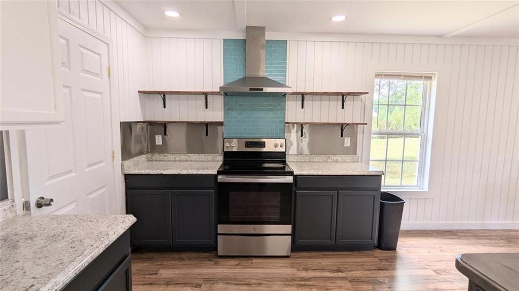500 Coleman Mill Road Carrollton, GA 30116 - Photo 71 of 83 a kitchen with stainless steel appliances granite countertop a stove and a sink