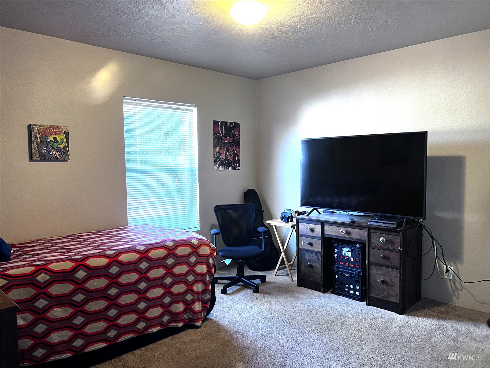 234 Boone Road Toledo, WA 98591 - Photo 12 of 33 a bedroom with a bed and a flat screen tv