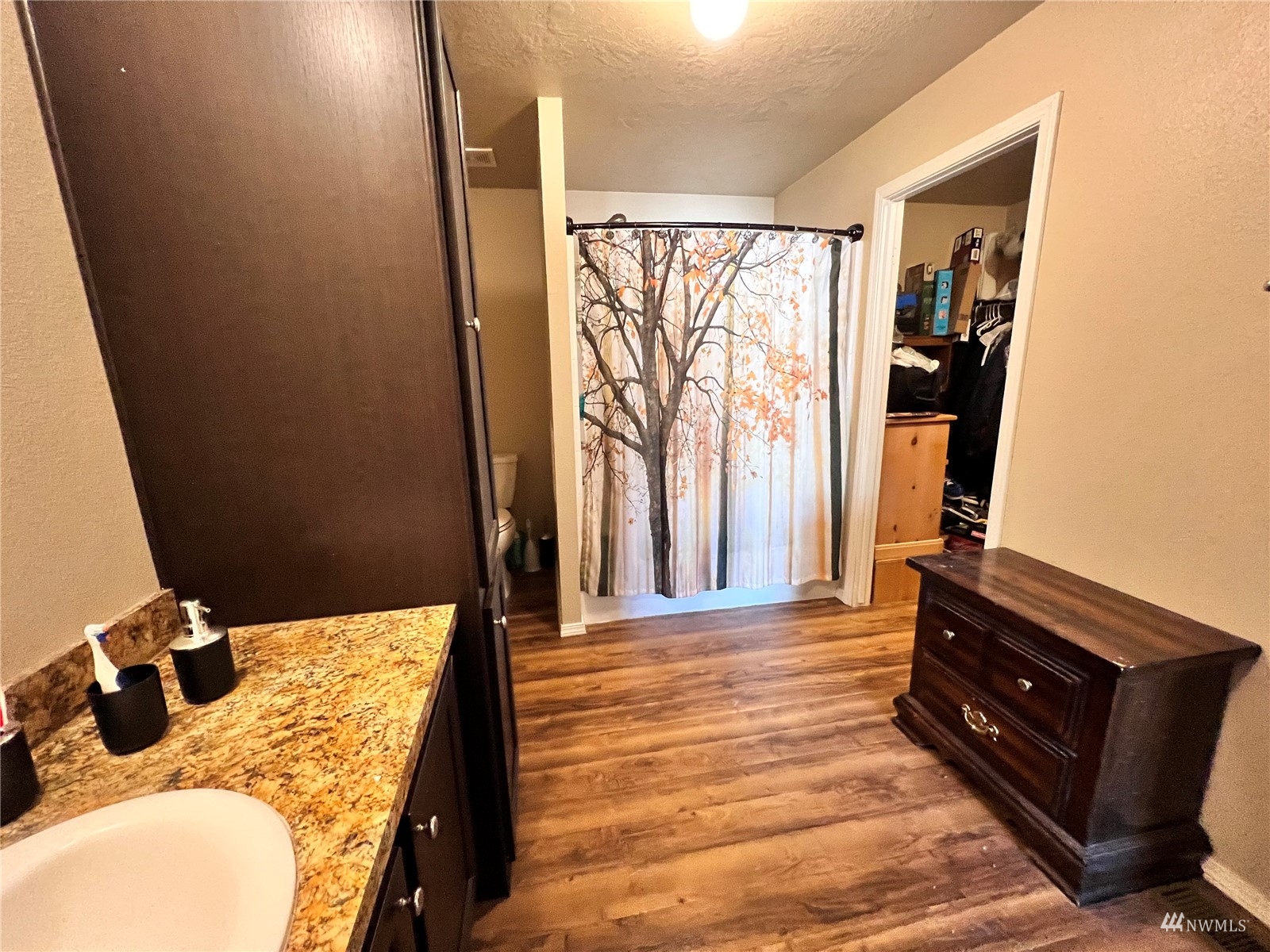 234 Boone Road Toledo, WA 98591 - Photo 21 of 33 a bedroom with a bed and wooden floor