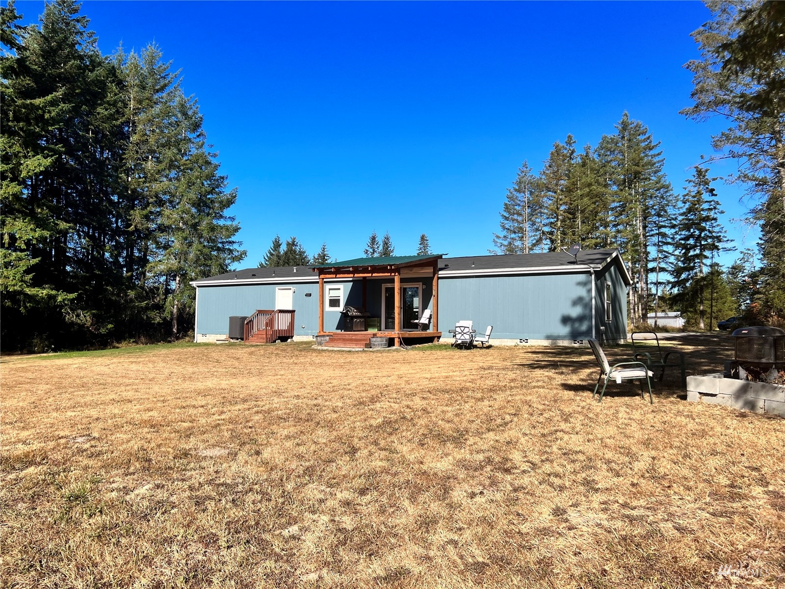 234 Boone Road Toledo, WA 98591 - Photo 23 of 33 a view of a house with a yard and tree