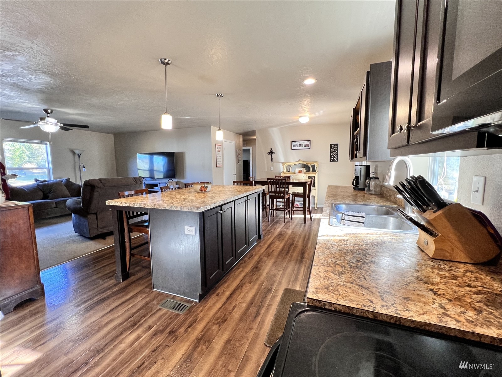 234 Boone Road Toledo, WA 98591 - Photo 6 of 33 a large kitchen with lots of counter space a sink appliances and cabinets