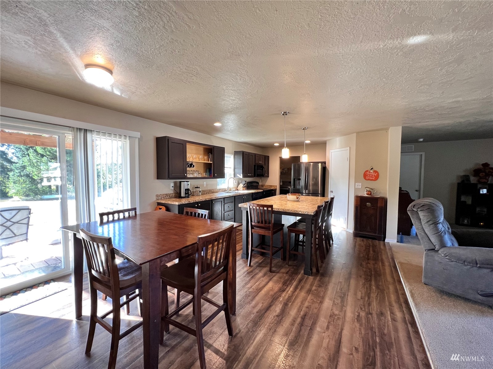 234 Boone Road Toledo, WA 98591 - Photo 8 of 33 a view of a dining room with furniture and wooden floor