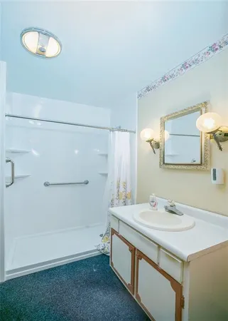 a bathroom with a sink and a mirror