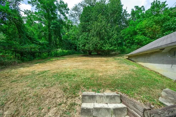 a view of a yard with an outdoor space