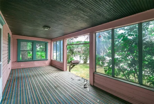 a view of balcony with wooden floor