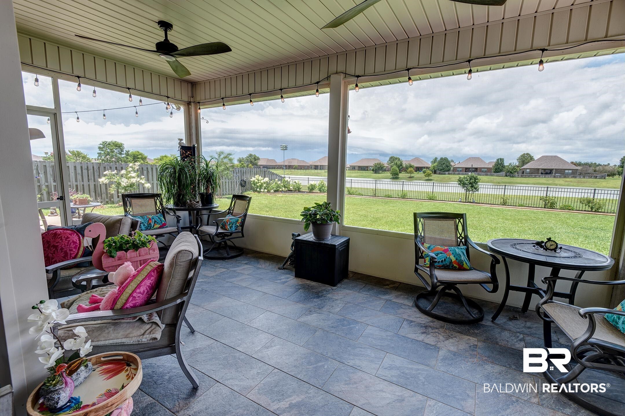 9988 Dunleith Loop Daphne, AL 36526 - Photo 21 of 51 Sunroom / solarium featuring ceiling fans, a wealth of natural light, and insulated ceiling. Additional plug outlets, 2 doors and tiled floors