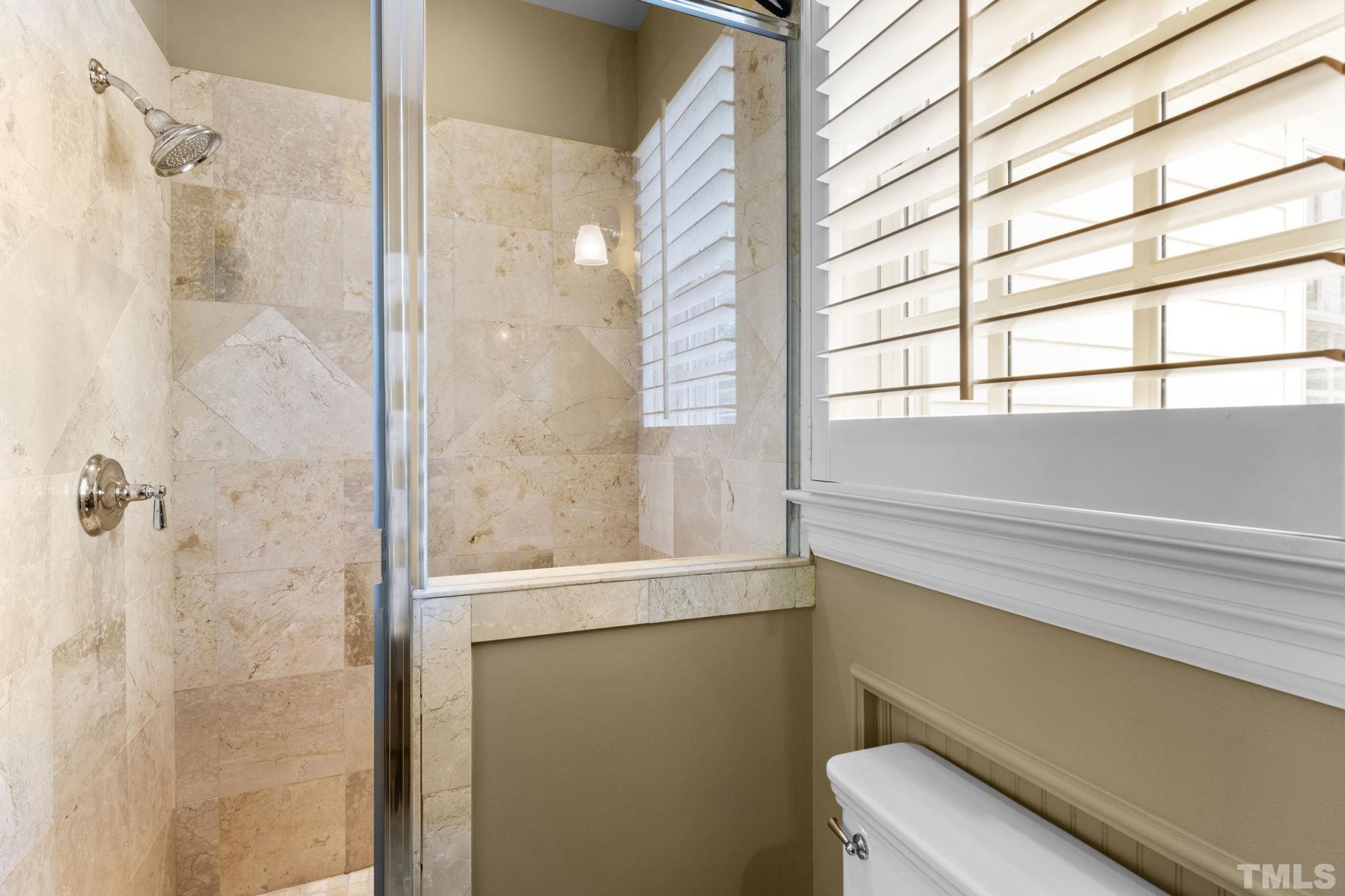 224 Hawthorne Road Raleigh, NC 27605 - Photo 32 of 46 a bathroom with a shower and a window