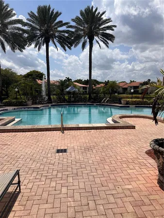 a view of swimming pool with a lake