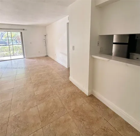 a view of an empty room with windows