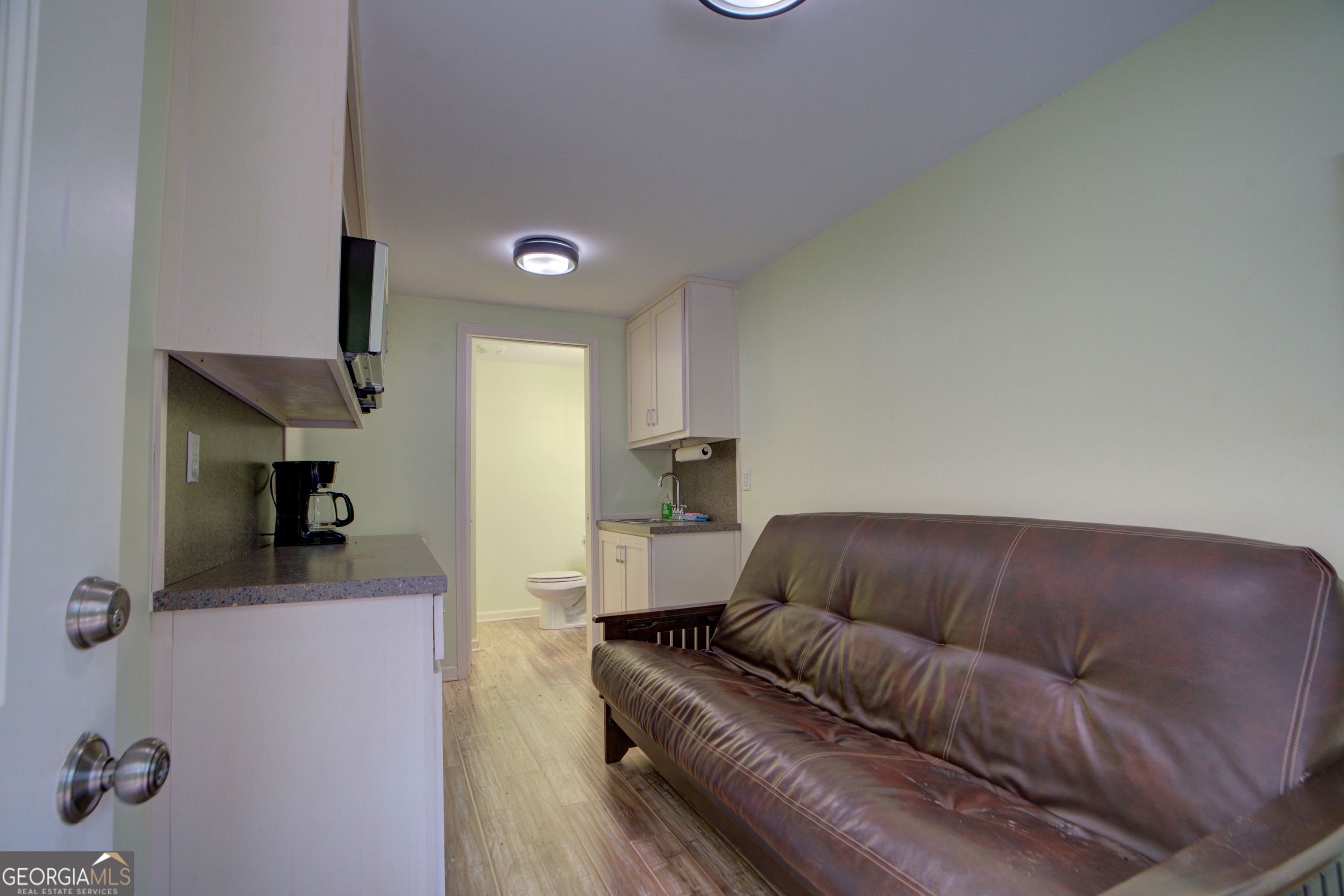 610 Kings Bridge Road Cave Spring, GA 30124 - Photo 64 of 72 a living room with furniture and a flat screen tv