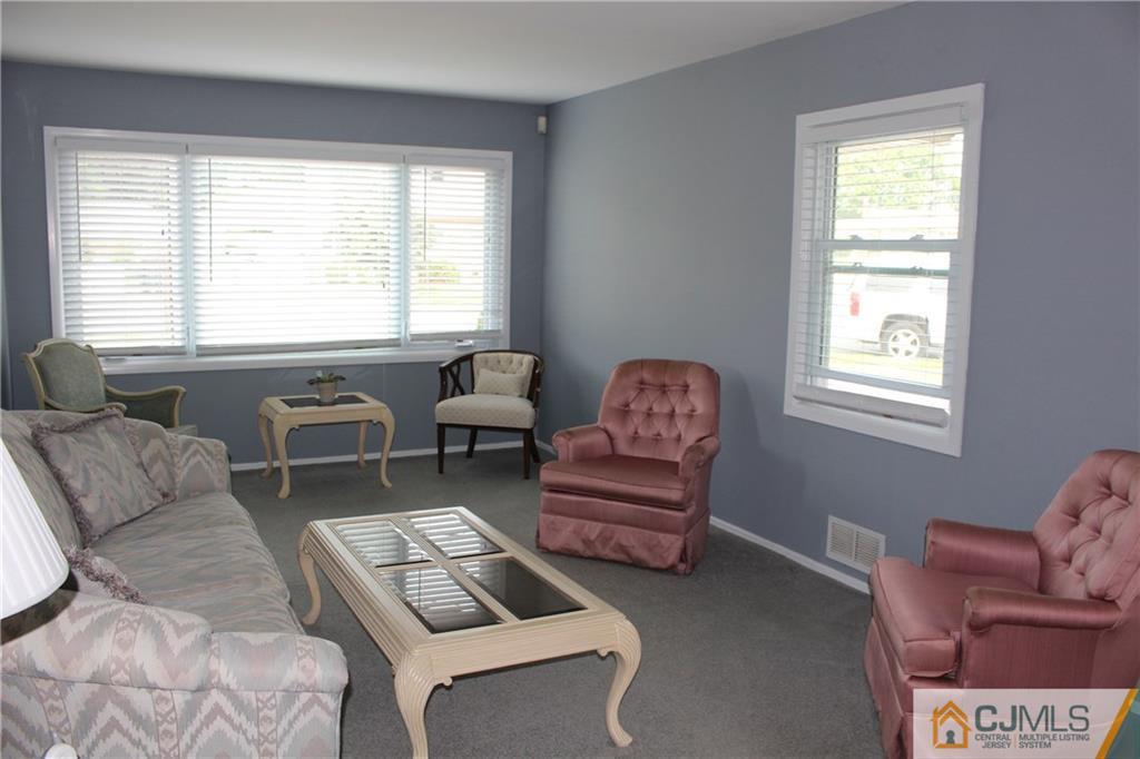 32 Gurley Road Edison, NJ 08817 - Photo 11 of 20 a living room with furniture and a window