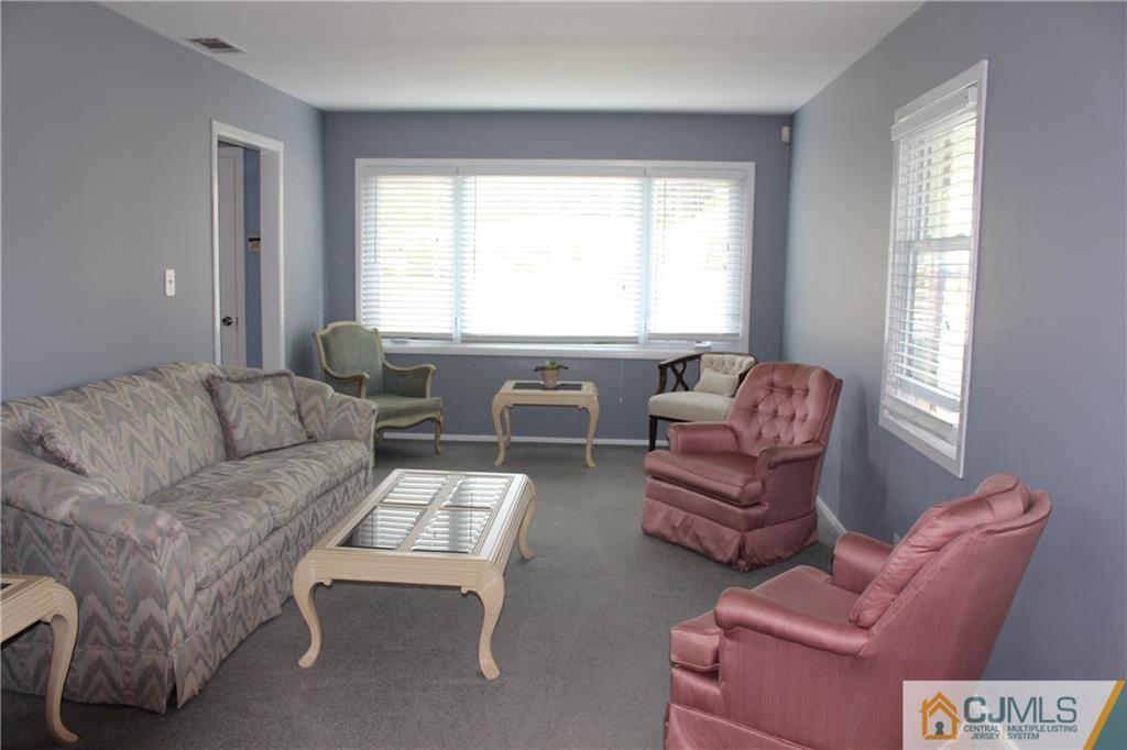 32 Gurley Road Edison, NJ 08817 - Photo 12 of 20 a living room with furniture and a large window