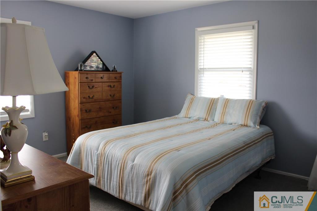 32 Gurley Road Edison, NJ 08817 - Photo 13 of 20 a bedroom with bed and window