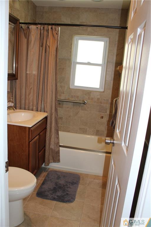 32 Gurley Road Edison, NJ 08817 - Photo 16 of 20 a bathroom with a sink a toilet and shower