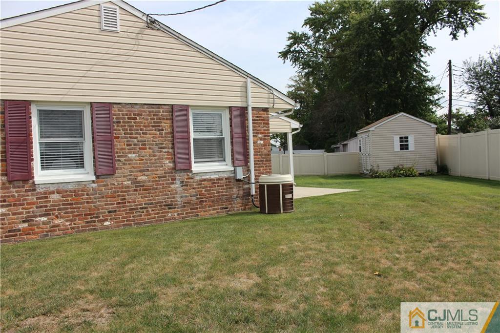 32 Gurley Road Edison, NJ 08817 - Photo 18 of 20 a view of a house with a yard