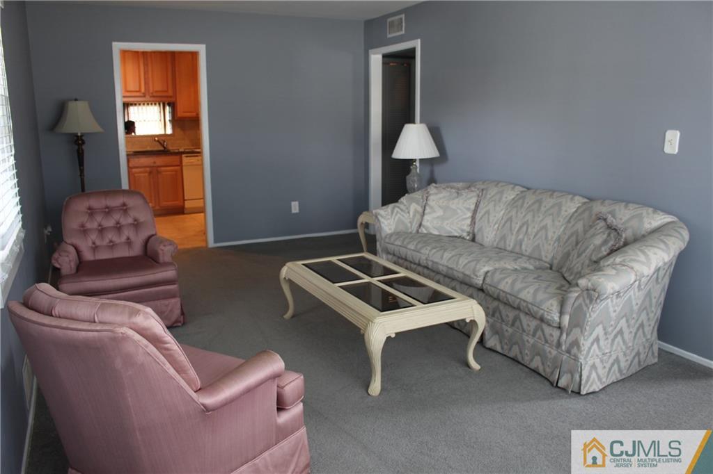 32 Gurley Road Edison, NJ 08817 - Photo 19 of 20 a living room with furniture and a couch