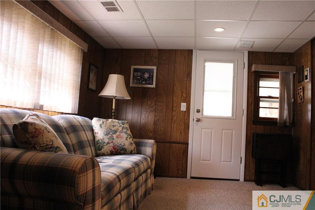 32 Gurley Road Edison, NJ 08817 - Photo 4 of 20 a bedroom with a bed and a lamp