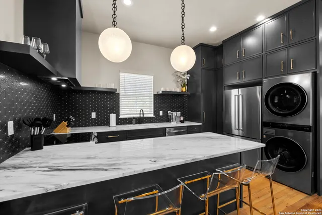 a kitchen with a table and chairs in it