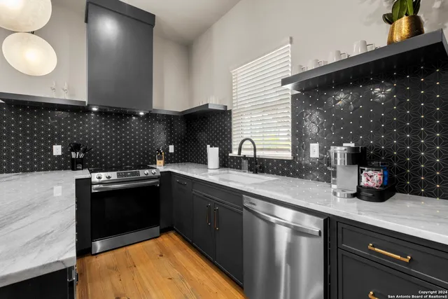 a kitchen with a sink and cabinets