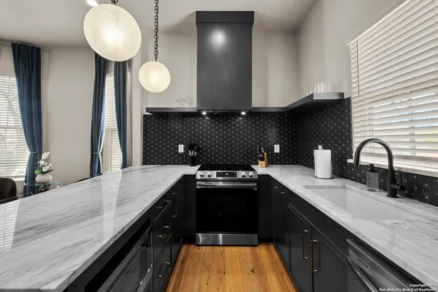 a kitchen with a sink and stove