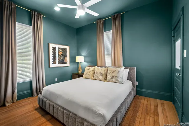 a bedroom with a bed and window