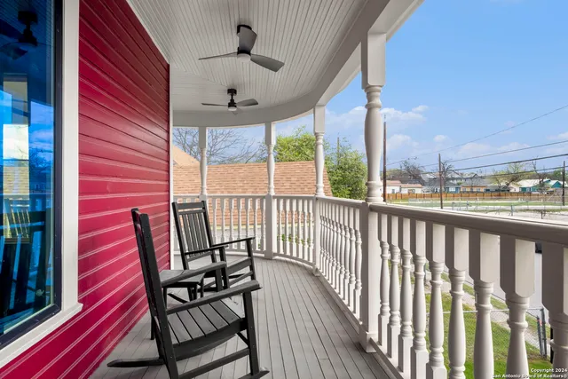 a view of a balcony with furniture