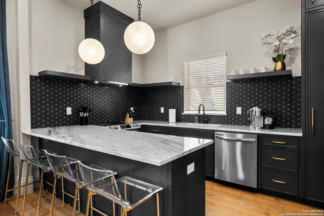a kitchen with a table and chairs in it