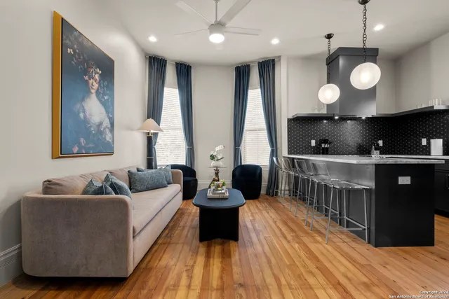 a living room with furniture and a large window