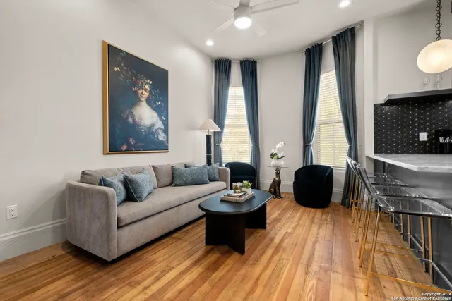 a living room with furniture and a fireplace