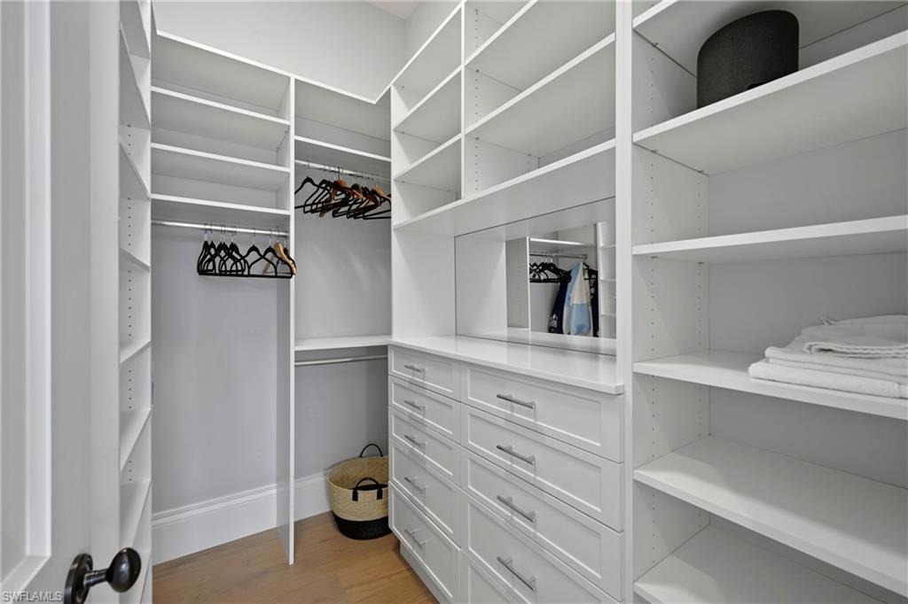 215 3rd Avenue North Naples, FL 34102 - Photo 35 of 47 Walk in closet featuring light wood finished floors