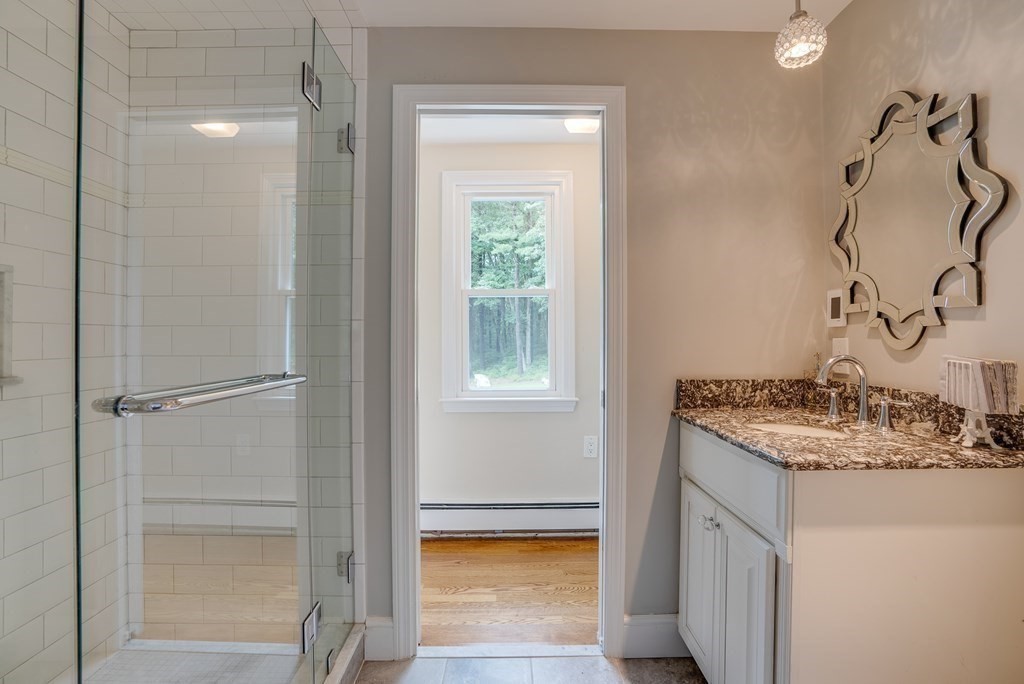 45 Towne Road Boxford, MA 01921 - Photo 34 of 42 a bathroom with a sink a vanity and a mirror