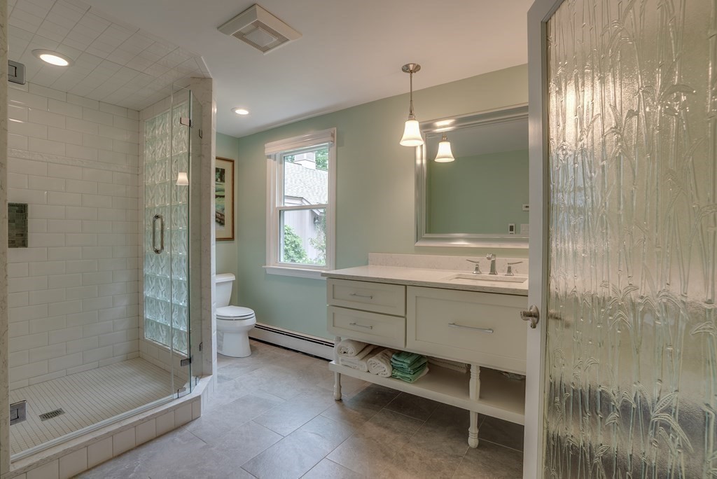 45 Towne Road Boxford, MA 01921 - Photo 38 of 42 a bathroom with a shower a sink and a mirror
