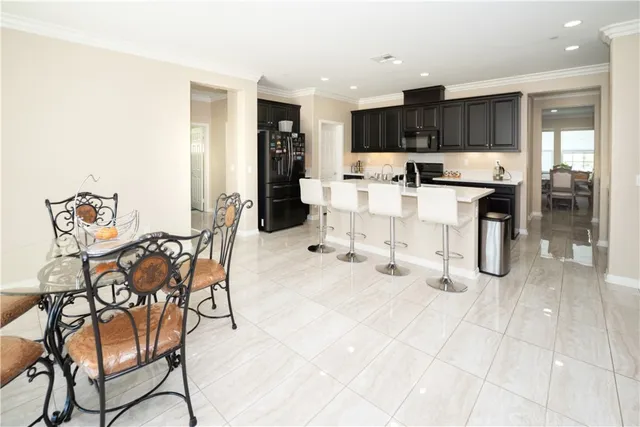 a kitchen with granite countertop a sink a stove and cabinets