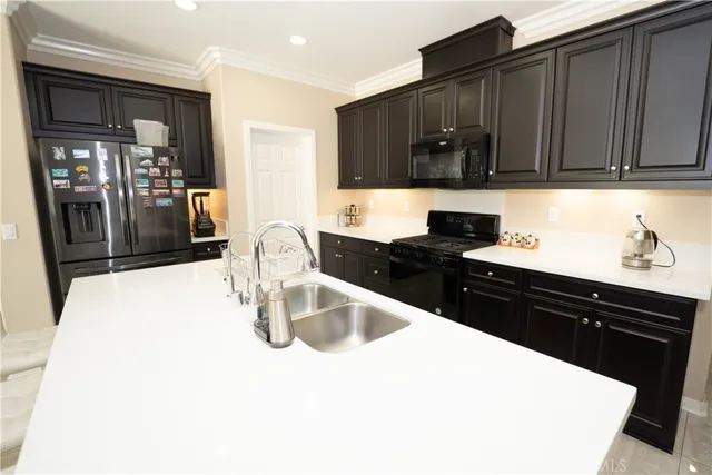 a kitchen with a sink and cabinets
