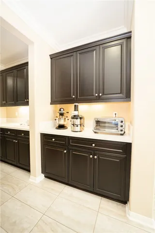 a kitchen with a sink cabinets and a table