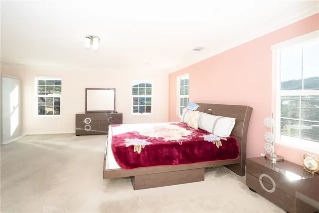 a spacious bathroom with a double vanity sink and mirror