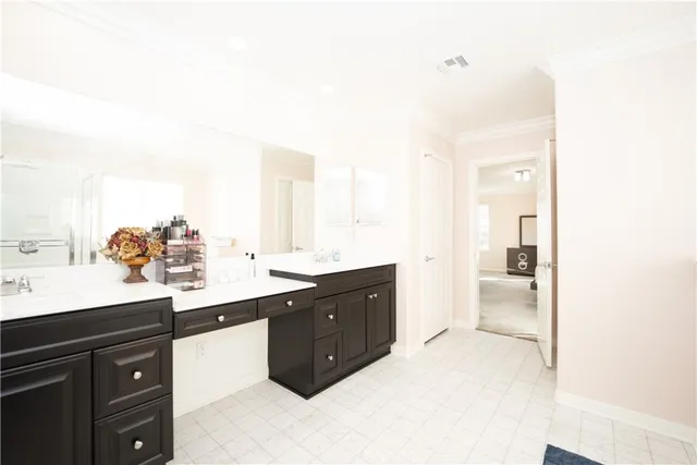 a bathroom with a tub shower and a sink