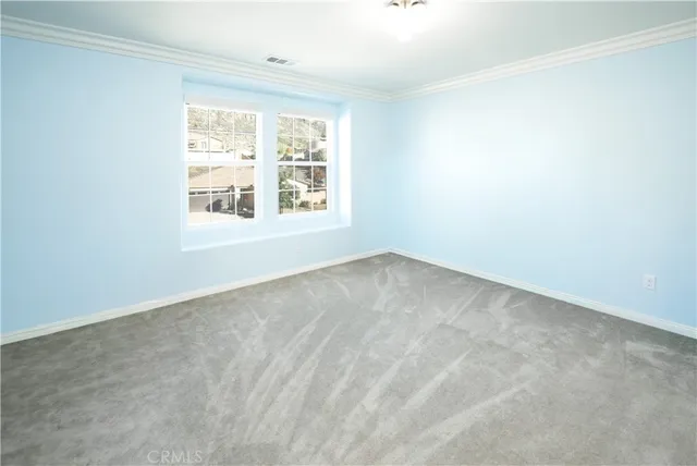 a view of a house with a wooden wall