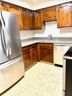 307 South Dithridge Street, Unit 11 Pittsburgh, PA 15213 - Photo 11 of 25 a kitchen with granite countertop a refrigerator and a sink