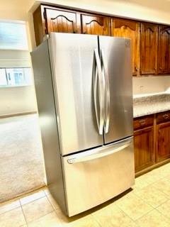 307 South Dithridge Street, Unit 11 Pittsburgh, PA 15213 - Photo 8 of 25 a view of a refrigerator in kitchen with wooden floor