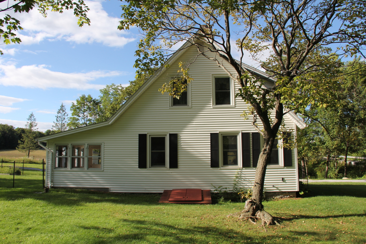 1730 State Road Richmond, MA 01254 - Photo 4 of 37 a front view of a house with a yard